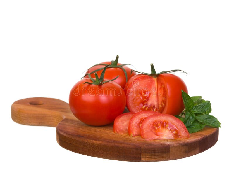 Tomatoes ensemble sliced on wooden plank