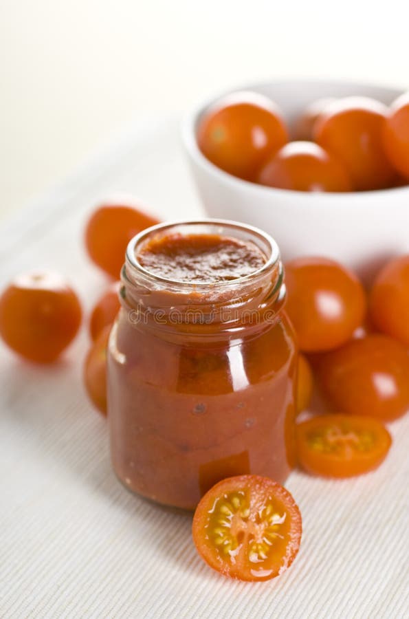 Tomatoes and ketchup stock image. Image of tomato, branch 17711381