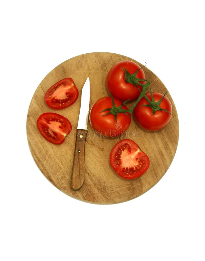 Tomatoes on kitchen board isolated on white