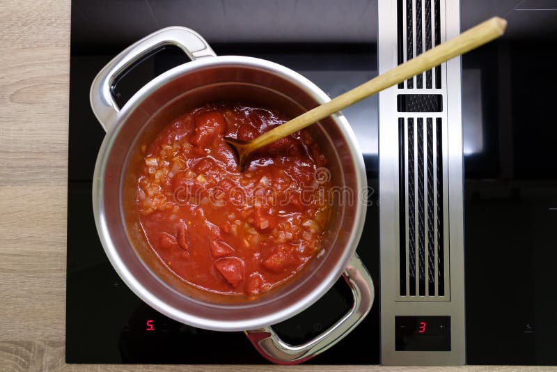 Tomatoes, Pot and a Spoon stock photo. Image of tomato - 17261752