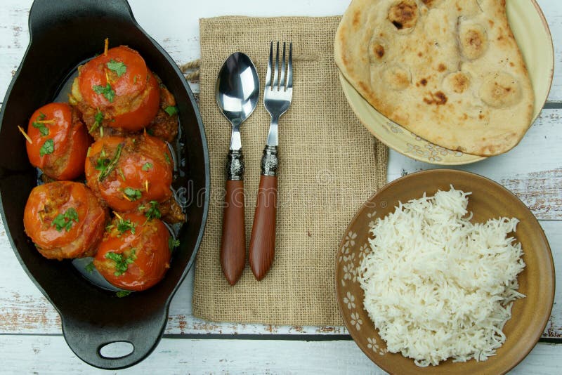 Tomatoes Stuffed with a Spicy Mixture of Mashed Potatoes in an Indian