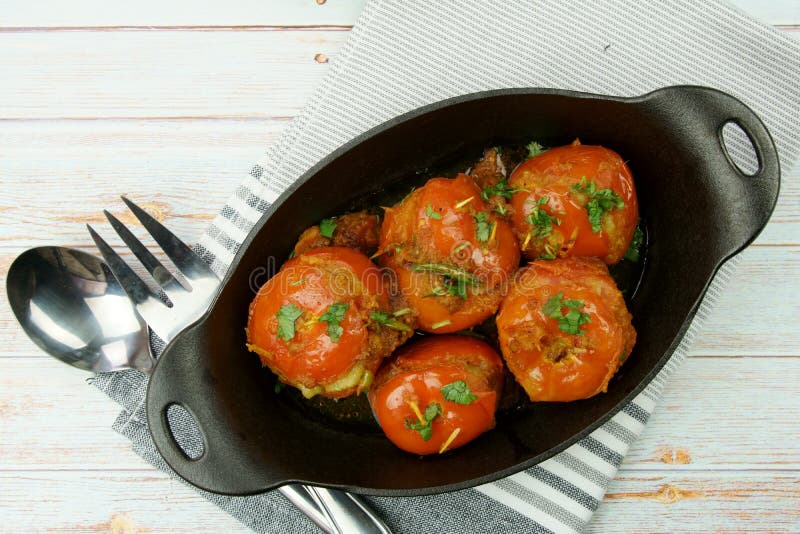 Tomatoes Stuffed with a Spicy Mixture of Mashed Potatoes in an Indian