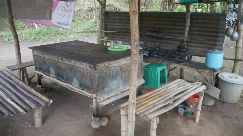 An Empty Bamboo Chairs and Table in an Empty Stall, Kediri, East Java, Indonesia, October 9, 2022. An Empty Bamboo Chairs and Table in an Empty Stall, Kediri, East Java, Indonesia, October 9, 2022