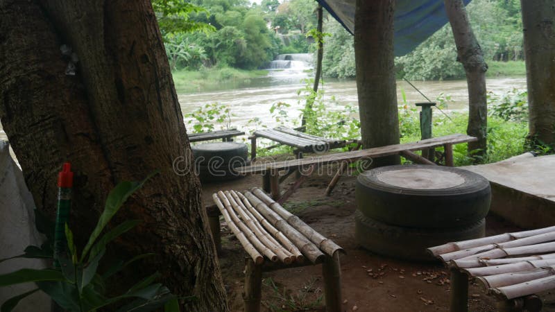 An Empty Bamboo Chairs and Table in an Empty Stall, Kediri, East Java, Indonesia, October 9, 2022. An Empty Bamboo Chairs and Table in an Empty Stall, Kediri, East Java, Indonesia, October 9, 2022