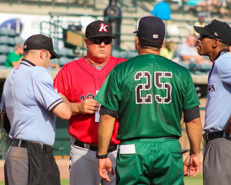 Managers Tommy Thompson (red) and Luis Dorante (green) meet at home plate before the start of a game between Kannapolis and Charleston. Managers Tommy Thompson (red) and Luis Dorante (green) meet at home plate before the start of a game between Kannapolis and Charleston.