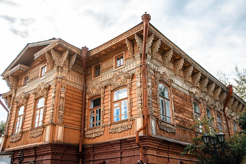 Tomsk, Russia - August  15, 2020: Carved wooden trim facade. Old historic house.