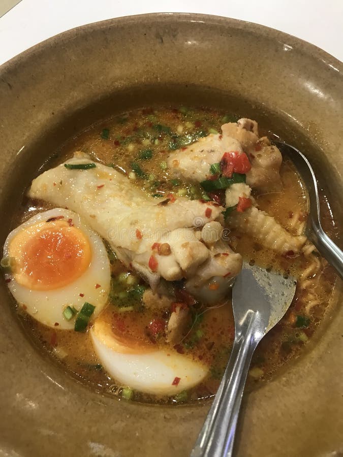 TomYum noodle with chicken and egg.