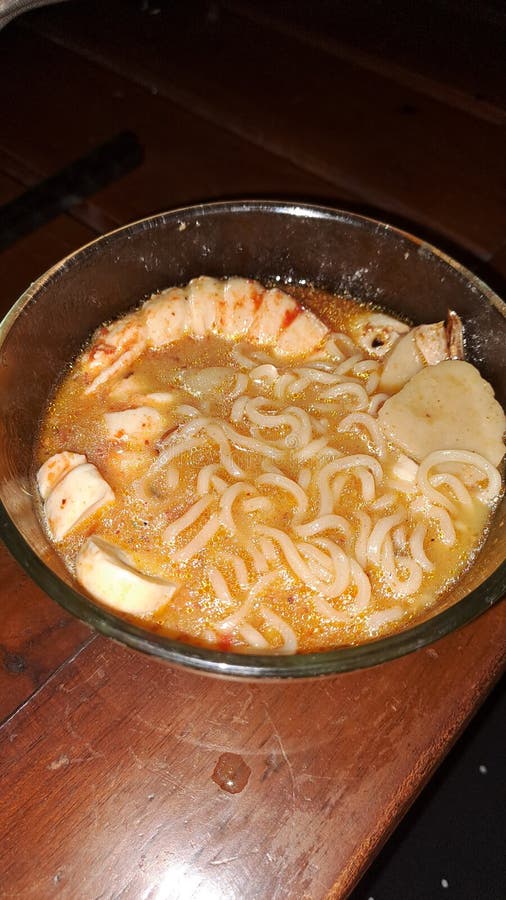 Tomyum noodle soup with prawns, meatballs and spicy curry