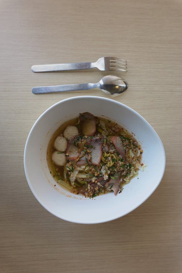 Tomyum noodle on wood table.