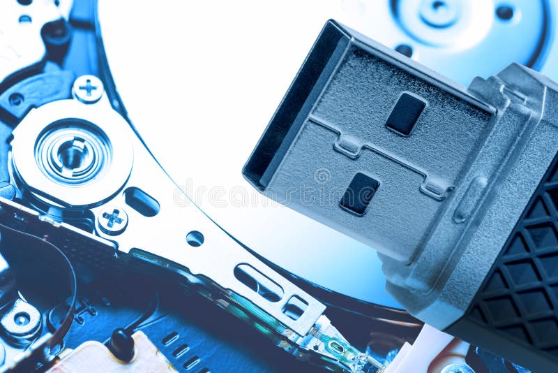 Toned Image Of USB Memory Stick Against Hard Disk Drive Plate