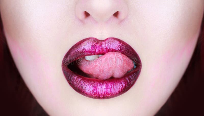 Tongue and mouth. Woman lip, female lips. Beautiful lip, lipstick and lipgloss, passionate. lips, tongue out royalty free stock photography Tongue and mouth. Woman lip, female lips. Beautiful lip, lipstick and lipgloss, passionate. lips, tongue out royalty free stock photography