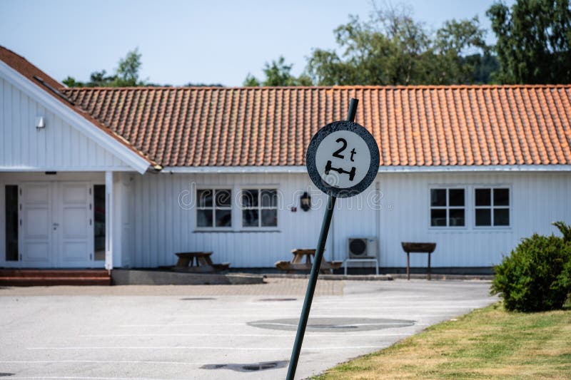 2 Tonnes Axle Weight Restriction Sign at a Parking Lot.. Stock Image