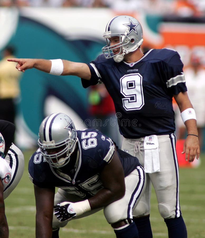 Dallas Cowboys quarterback Tony Romo leads his offense in 1st quarter NFL action against the Miami Dolphins at Dolphin Stadium in Miami on September 16, 2007. Dallas Cowboys quarterback Tony Romo leads his offense in 1st quarter NFL action against the Miami Dolphins at Dolphin Stadium in Miami on September 16, 2007.