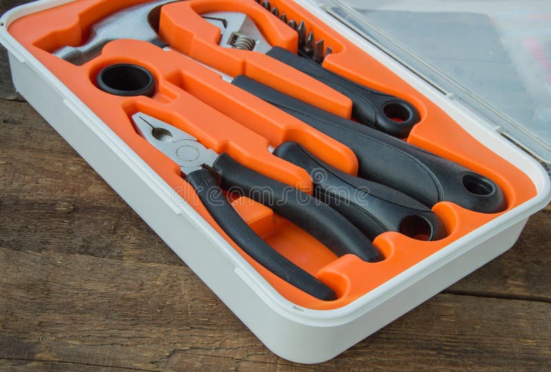 Tool Kit Pliers, Hammer, Screwdriver in Orange Plastic Case on Old
