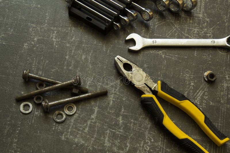 Tool Set of Pliers, Wrenches, Bolts and Nuts on Abstract Grey Surface Stock Image Image of