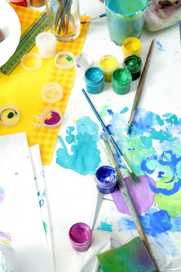 Tools of the artist: paints, brushes and a paper royalty free stock images