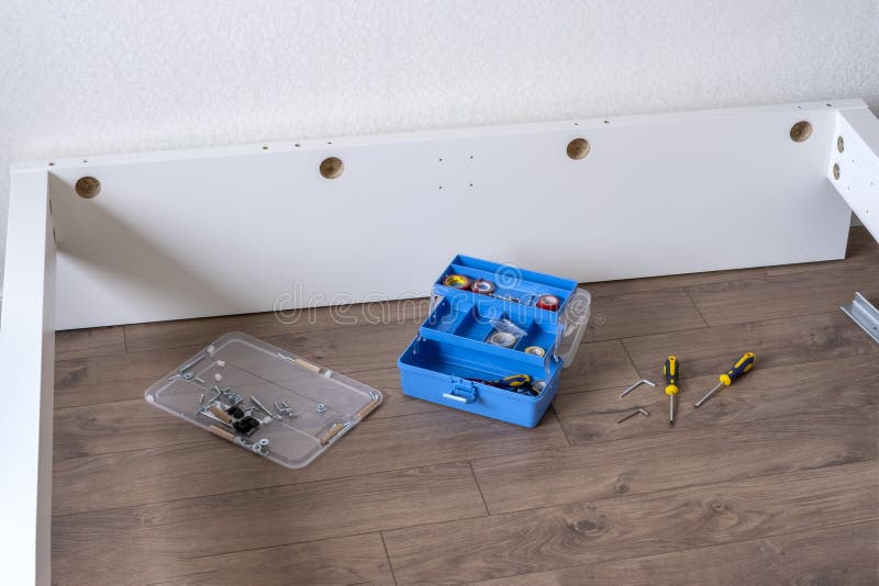 Tools for Assembling the Bed. Screwdrivers on the Floor for Furniture