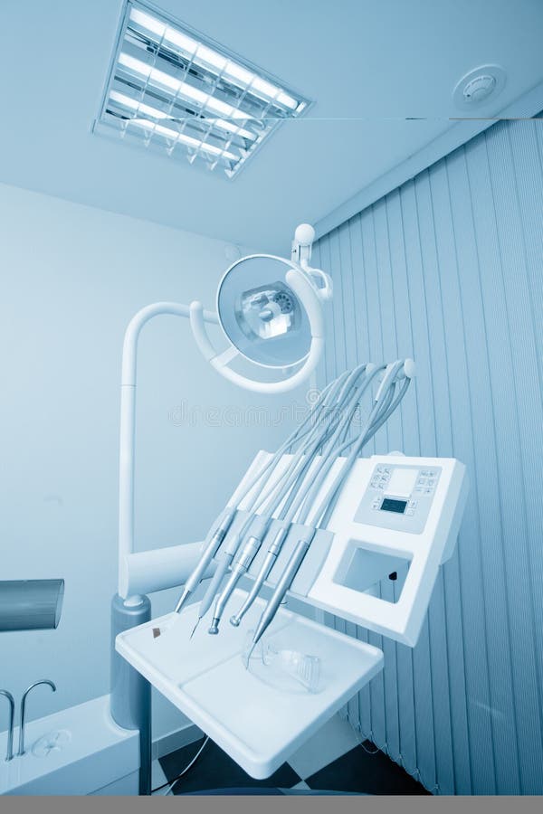 Dentist Blue Background with Tooth and Stethoscope Stock Photo Image