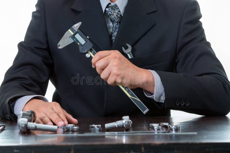 Tools and mechanical engineer working with many tightening wrench and holding digital vernier royalty free stock images Tools and mechanical engineer working with many tightening wrench and holding digital vernier royalty free stock images