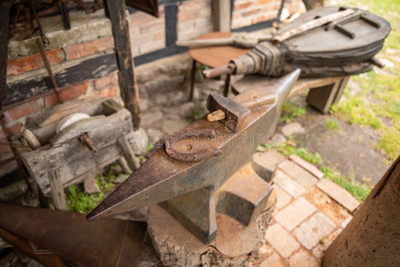 Tools in an Old Blacksmith& X27;s Horseshoe and Hammer on a