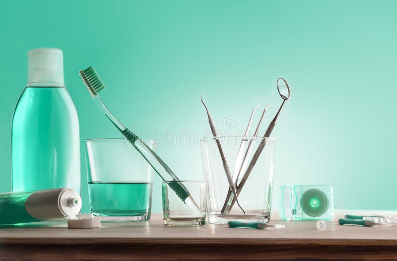 Tools for Oral Hygiene on Wooden Table with Green Background Stock