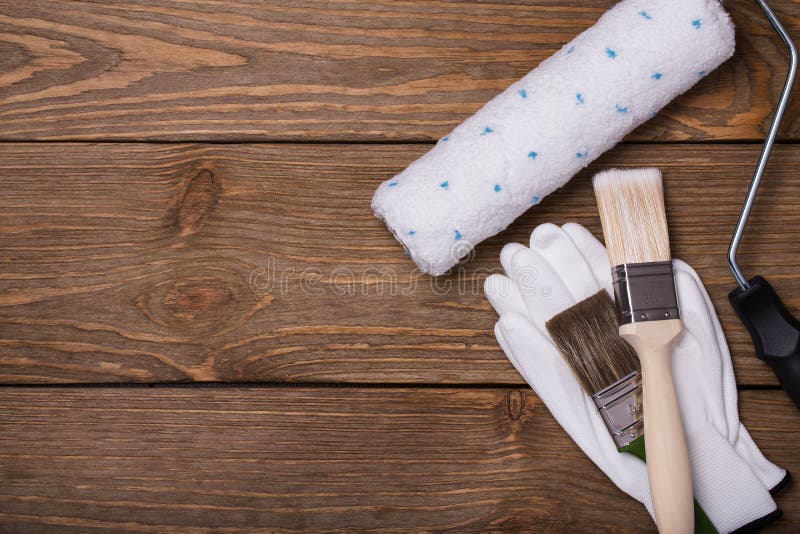 Tools for working with paint. Brush, roller and gloves royalty free stock image Tools for working with paint. Brush, roller and gloves royalty free stock image