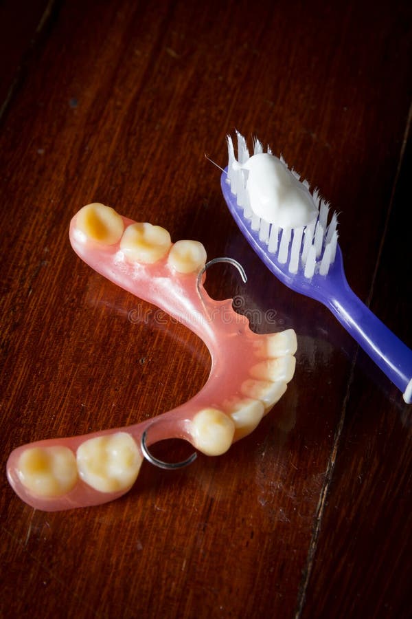 Tooth brush and dentures. stock image. Image of artificial 44652767