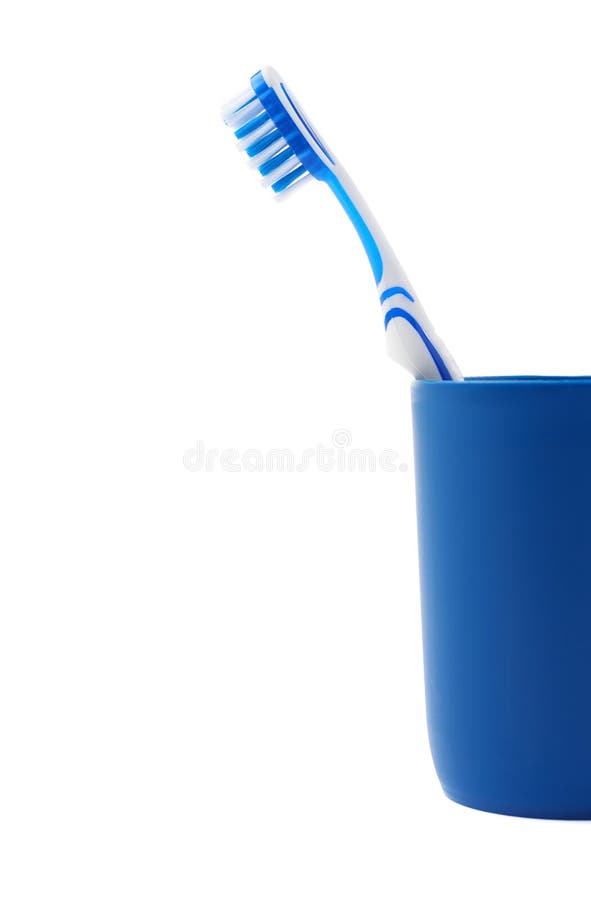 Toothbrush in Blue Plastic Cup Isolated Over White Background Stock