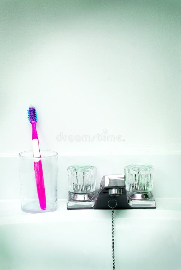 Toothbrush in a glass cup stock photo. Image of public 3778346