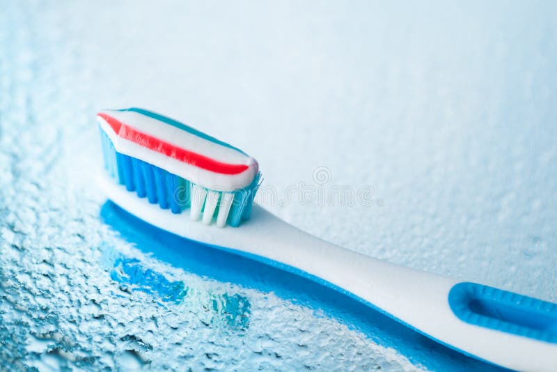 Toothbrush with Red Stripe Toothpaste Stock Image Image of hairs