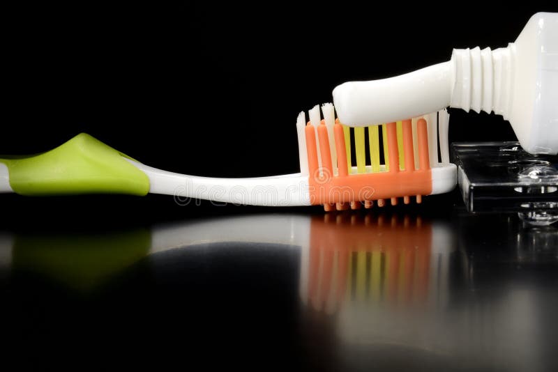 Toothbrush and toothpaste on table