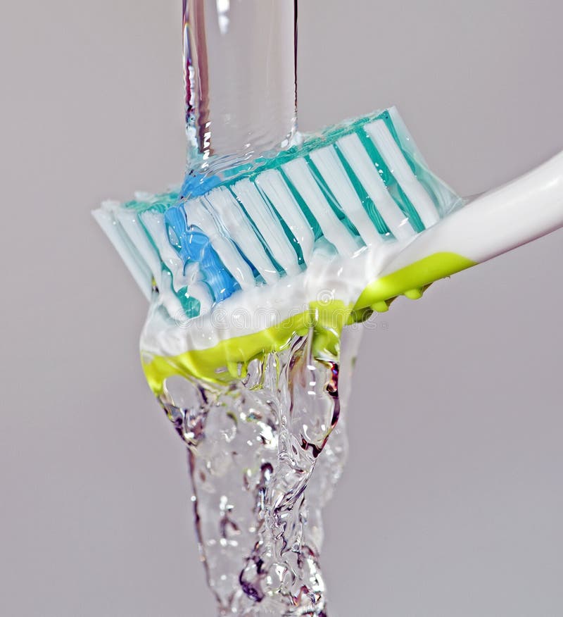 toothbrush under running water 22290842