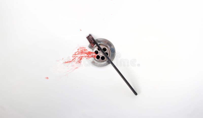 Toothpaste with blood in a ceramic sink. Bleeding gums. Close up royalty free stock image Toothpaste with blood in a ceramic sink. Bleeding gums. Close up royalty free stock image