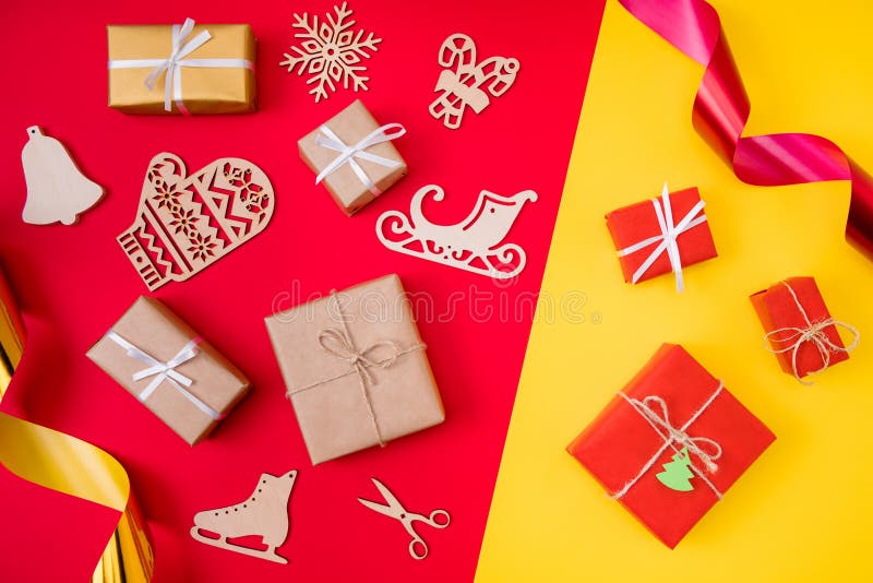 Top above high angle photo of traditional christmas wooden gloves sledges ice skates bells candies gift box composition stock photos Top above high angle photo of traditional christmas wooden gloves sledges ice skates bells candies gift box composition stock photos