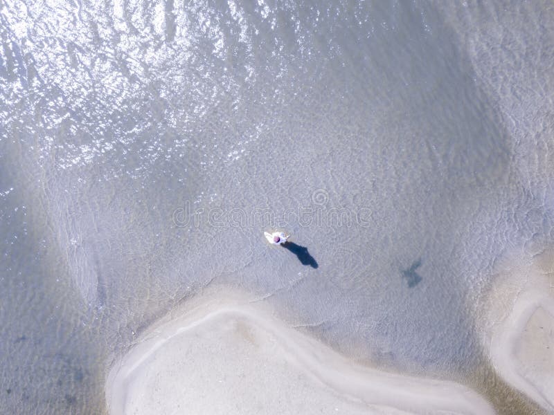 Top aerial high above view of man on exotic sea sandy beach. holiday resort concept f. Top aerial high above view of man on exotic sea sandy beach. holiday royalty free stock photography Top aerial high above view of man on exotic sea sandy beach. holiday resort concept f. Top aerial high above view of man on exotic sea sandy beach. holiday royalty free stock photography