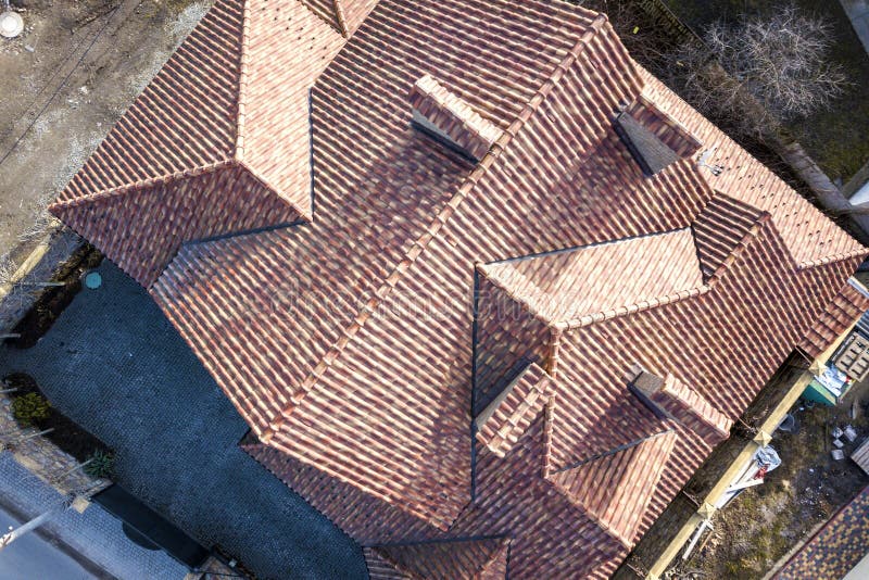 Top aerial view of building complex shingle roof construction. Abstract background.