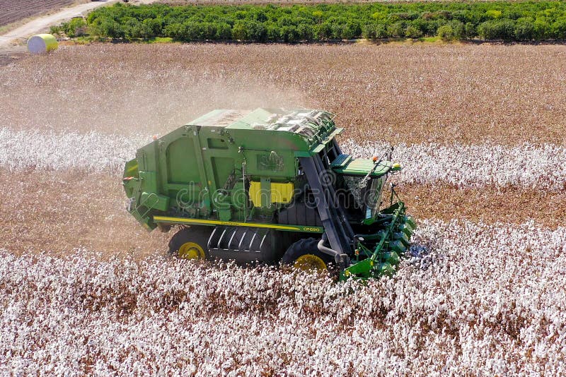 Aerial image of a Large Cotton picker harvesting a field. royalty free stock photography
