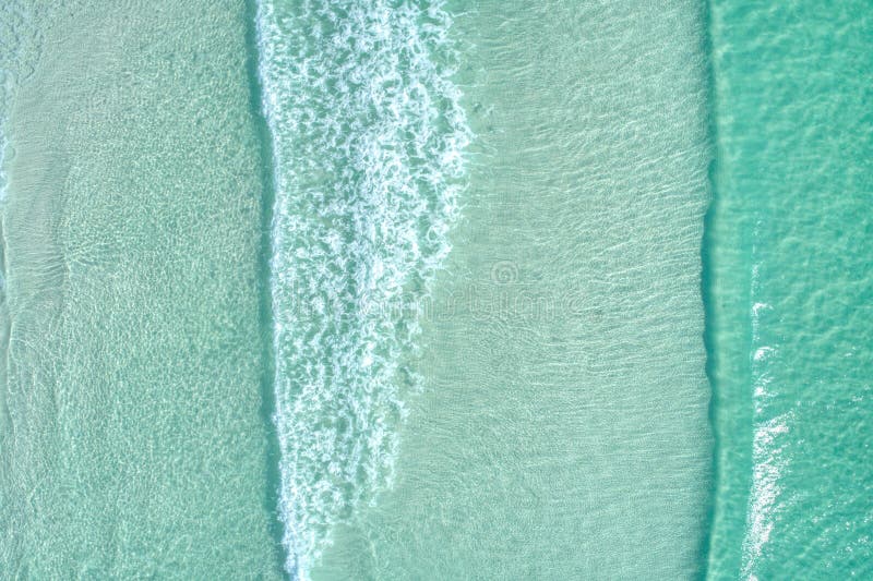 Top Down Aerial View of Breakers of Crystal Clear Water at a Florida 30A Beach