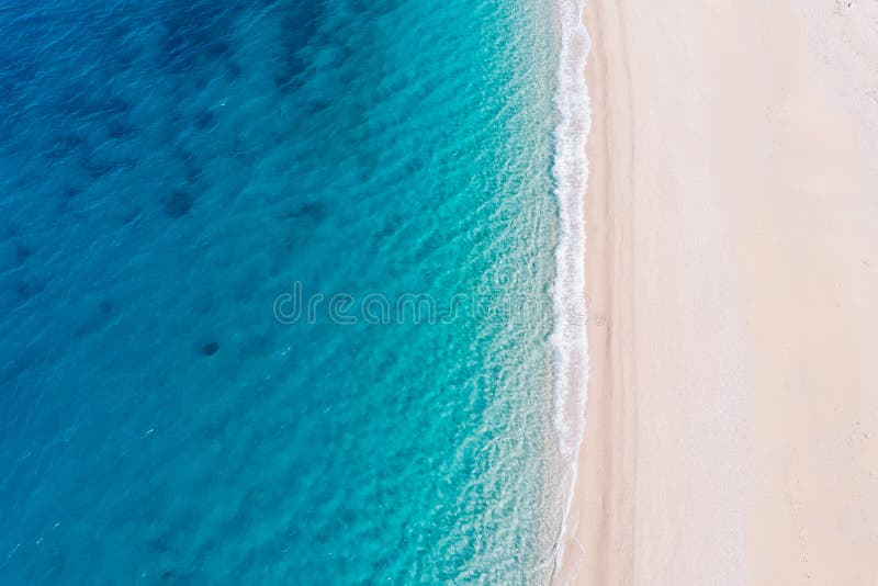 Top Down Aerial View Of A White Sandy Beach On The Shores Of A