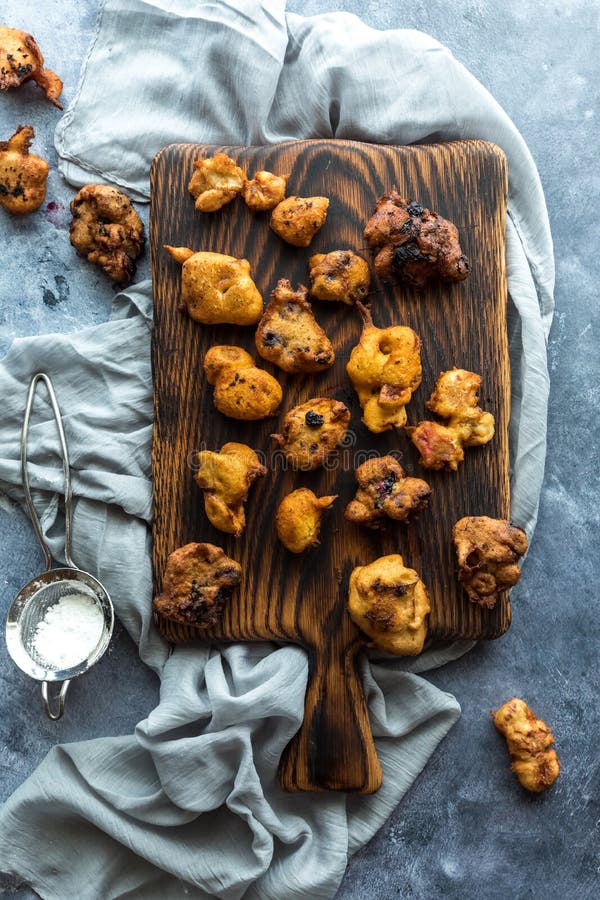 Top Down View of Homemade Deep Fried Fritters with Powdered Sugar