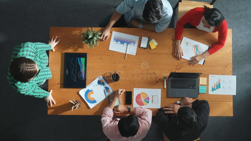 Top down view of manager holds tablet display increasing sales. Convocation. stock images