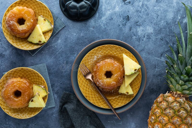 Top down view of mini pineapple upside down cakes with pineapple slices. stock photos