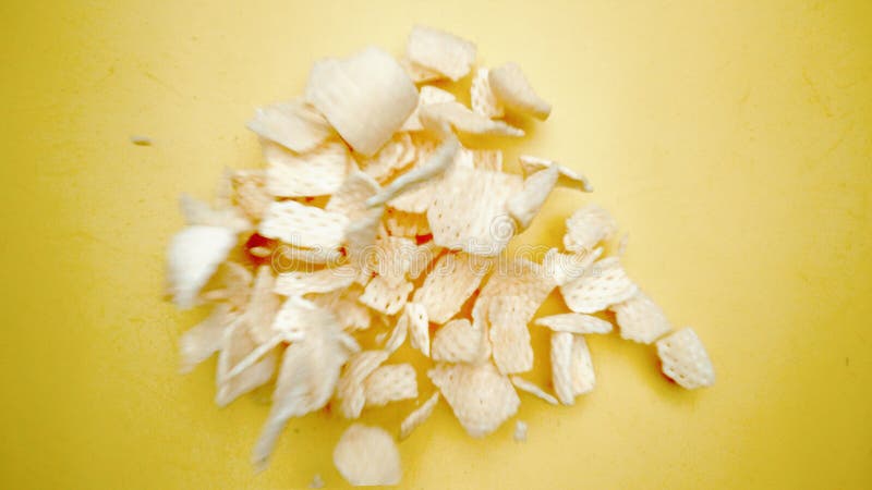 Top down view of snack flying in the air from explosion and falling. Pabulum. royalty free stock photography