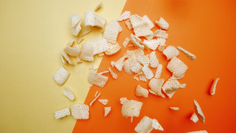 Top down view of snack flying in the air from explosion and falling. Pabulum. stock images