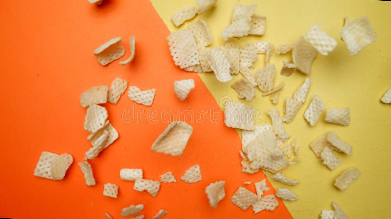 Top down view of snack flying in the air from explosion and falling. Pabulum. royalty free stock images