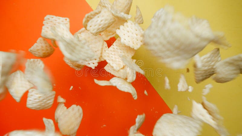 Top down view of snack flying in the air from explosion and falling. Pabulum. royalty free stock image