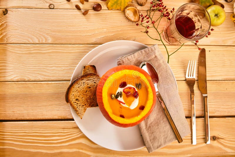 Top down view on squash with soup inside stock image