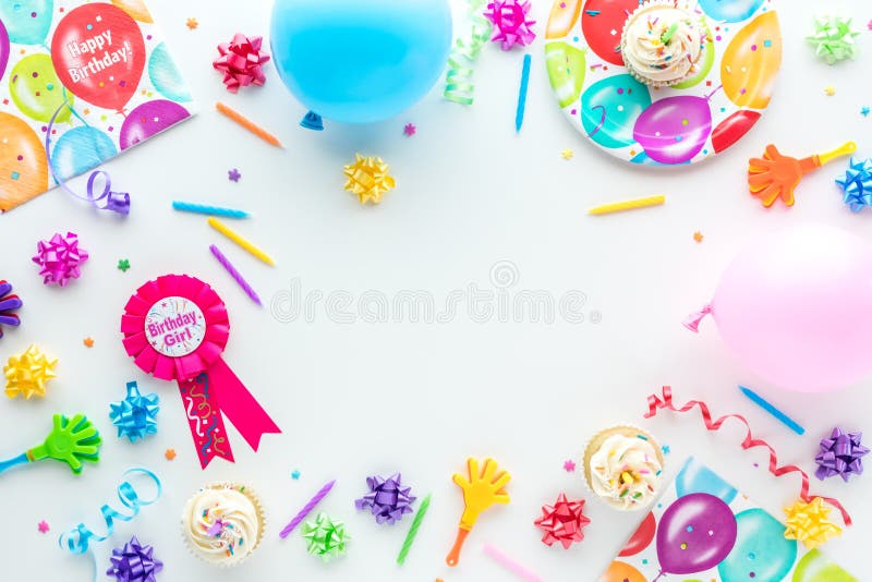 A top down view of various birthday party items for a birthday girl. royalty free stock photo