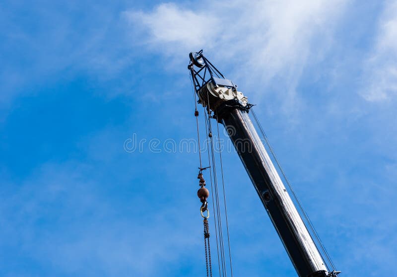Top Of Large Heavy Industrial Crane Extended With Hanging Cables Stock