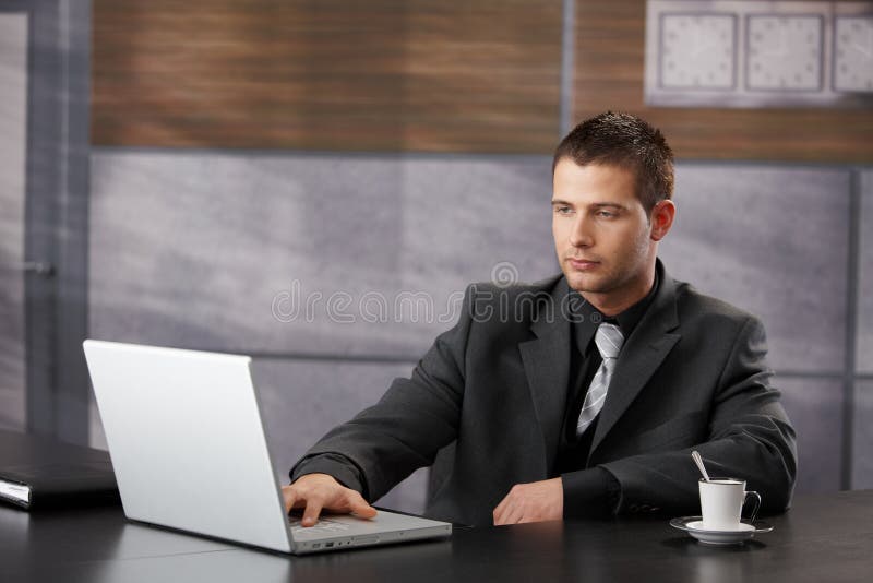Top manager working in fancy office stock image